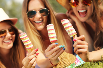 Happy women chilling with ice-cream