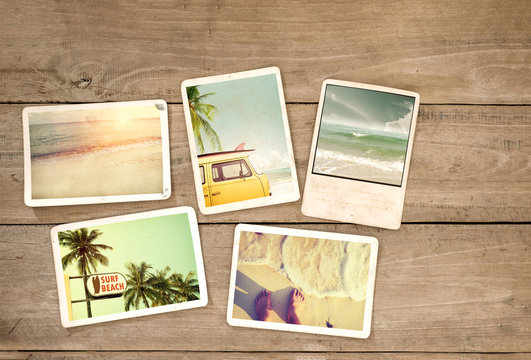 Photo album remembrance and nostalgia journey in summer surfing beach trip on wood table. instant photo of vintage camera - vintage and retro style