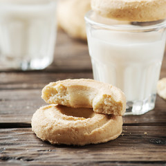 Sweet cookie and glass of milk on the vintage table