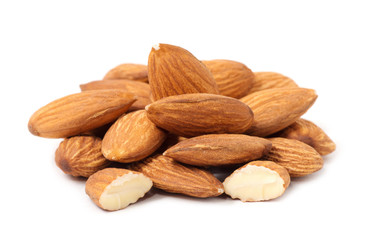 Heap of almond nuts isolated on white background
