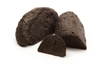 Yeastless coal bread on white background