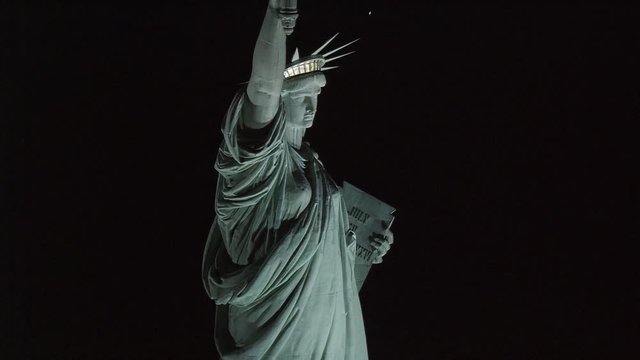 Flying over Statue of Liberty at night