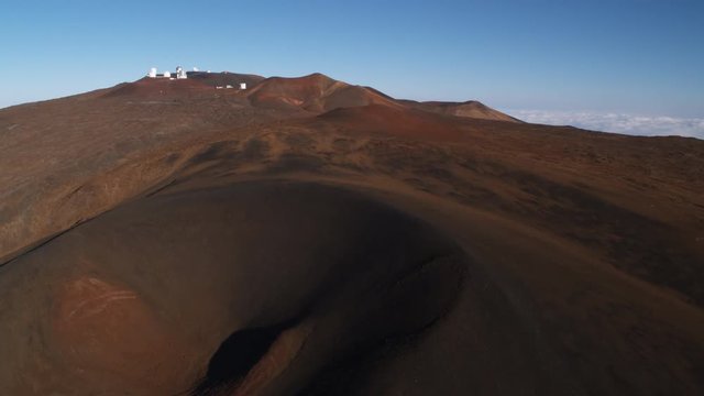 Past cinder cone on Mauna Loa with observatory in background. Shot in 2010.