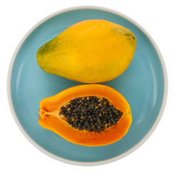 Papaya on a plate, white background