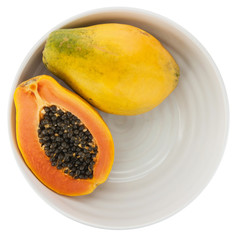 Papaya on a plate, white background