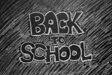 Back to school phrase written on blackboard