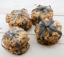 Place the cookies with a ribbon tied on a wooden floor.