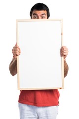 Handsome man holding an empty placard