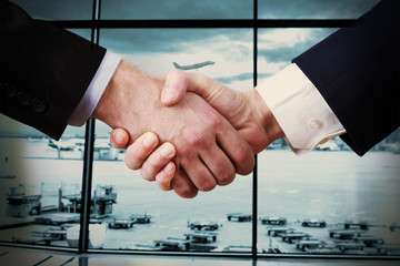 Business handshake on International Airport Terminal background