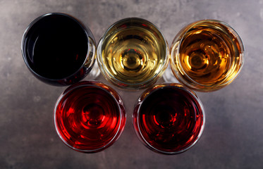 Glasses with wines of different colors on a table