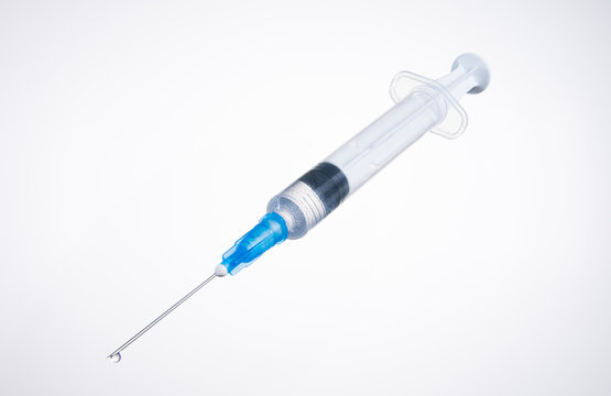 Syringe with a medicine on a white background