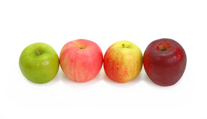A variety of apples in a row on white background
