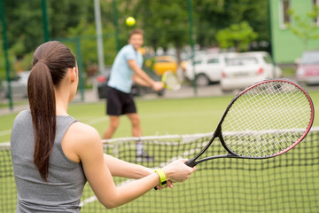 Skillful tennis players competing in stadium