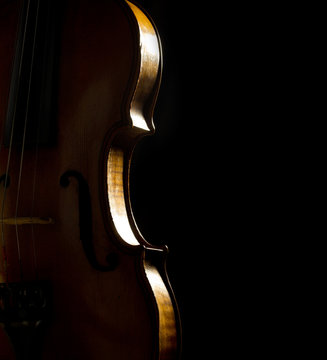 musical background with violin side on black