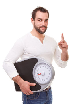 Man holding scale weight and reproaching
