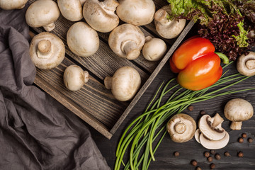 champignon mushrooms in a wooden box