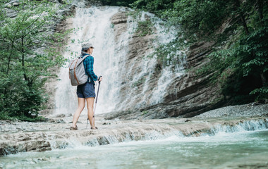 Hiker crossing the river