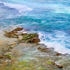 background of ocean waters and coastal stones