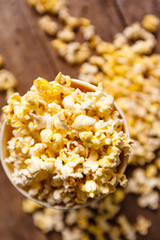 Popcorn on wooden background