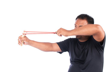 Young man pulling sling shot on white background