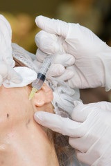 Fototapeta premium cosmetology, injection, plastic surgery face