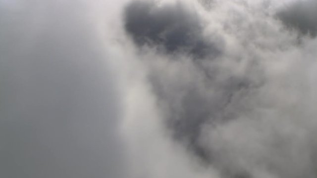 Flight to left through close-up clouds