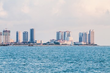 Fototapeta premium Tanjung Bungah high rise building view with mountain and sea, Penang Malaysia