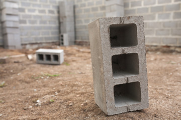 New house construction, building foundation walls using concrete blocks, copy space