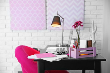 Workplace with laptop on table at home