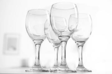 Wineglasses on blurred interior background