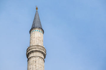 architecture and texture of minaret mosque in blue sky background