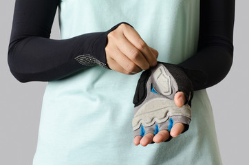 Woman wearing bicycle glove ready to cycling