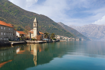 Fototapeta na wymiar Seaside village Stoliv with Holy Name of Mary Catholic Church. Bay of Kotor, Montenegro