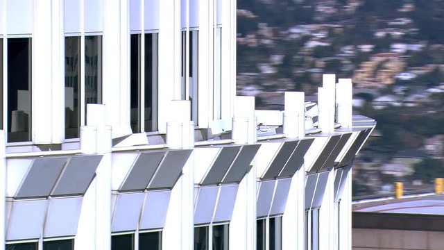Close orbit around skyscraper with projecting cornices