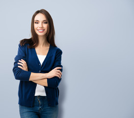 smiling young woman with crossed arms