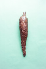 still life of cassava or manioca, isolated on pastel background,