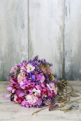 Wedding bouquet with freesias, carnations and pansy flowers.