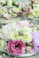 Floral arrangement with pink peonies, tiny roses, chrysanthemums