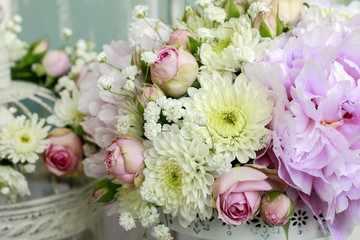 Floral arrangement with pink peonies, tiny roses, chrysanthemums