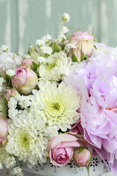 Floral arrangement with pink peonies, tiny roses, chrysanthemums