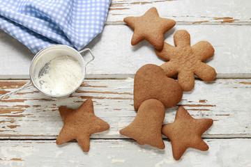 Christmas gingerbread cookies on a white wood