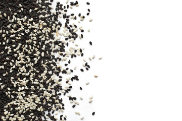 White and black sesame seeds on a white background