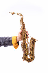 Naklejka premium Hand with saxofone on white