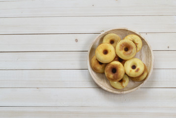 Donuts on wooden background