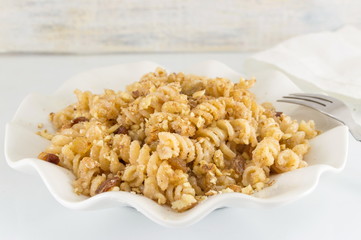 Sweet pasta with honey, nuts and raisins