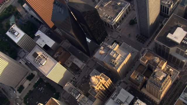 Looking down onto Houston skyscrapers from tilted wide orbiting flight. Shot in 2007.