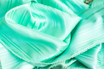 The smooth green silk, green clothing background