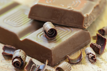 Chocolate with wood background - food