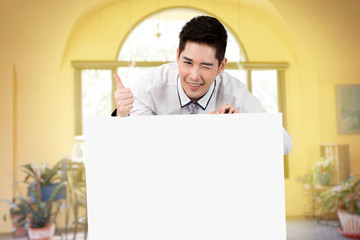 man hold blank white board smile and kidding