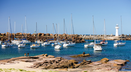 Fototapeta na wymiar Wollongong Harbor, Australia where boats of various types come for fishing and relaxation